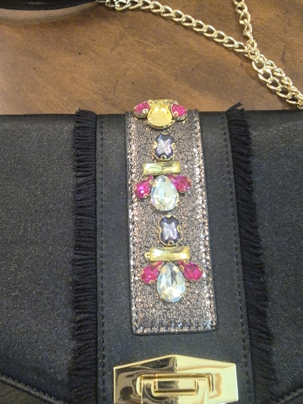 Black Crossbody Bag with Colorful Gem Embellishment and Gold Chain